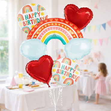 Colorful birthday balloons with rainbow and heart designs in a festive setting. - Party Centre