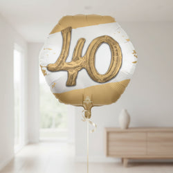 Gold and white balloon with the number 40 on a white background