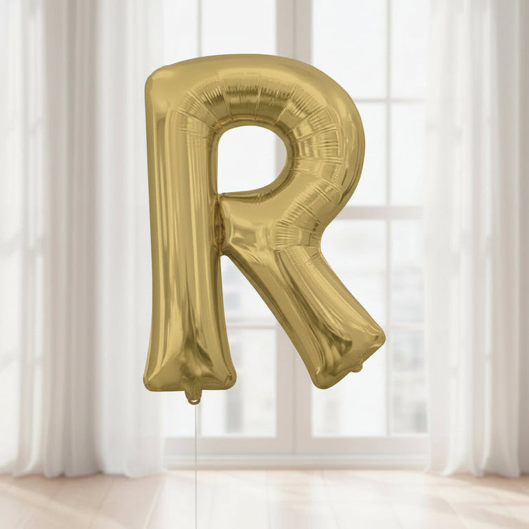 Gold letter 'R' balloon with Anagram logo on a white background