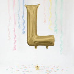 Gold letter 'L' balloon with pastel streamers and confetti on a white background